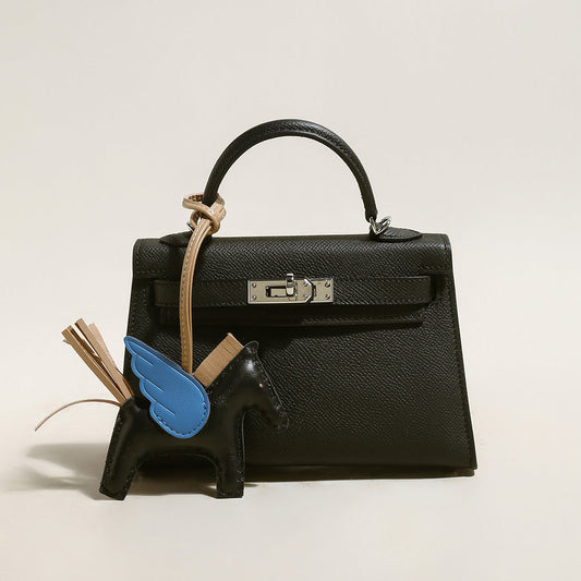 Petit sac à main tendance avec breloque cheval