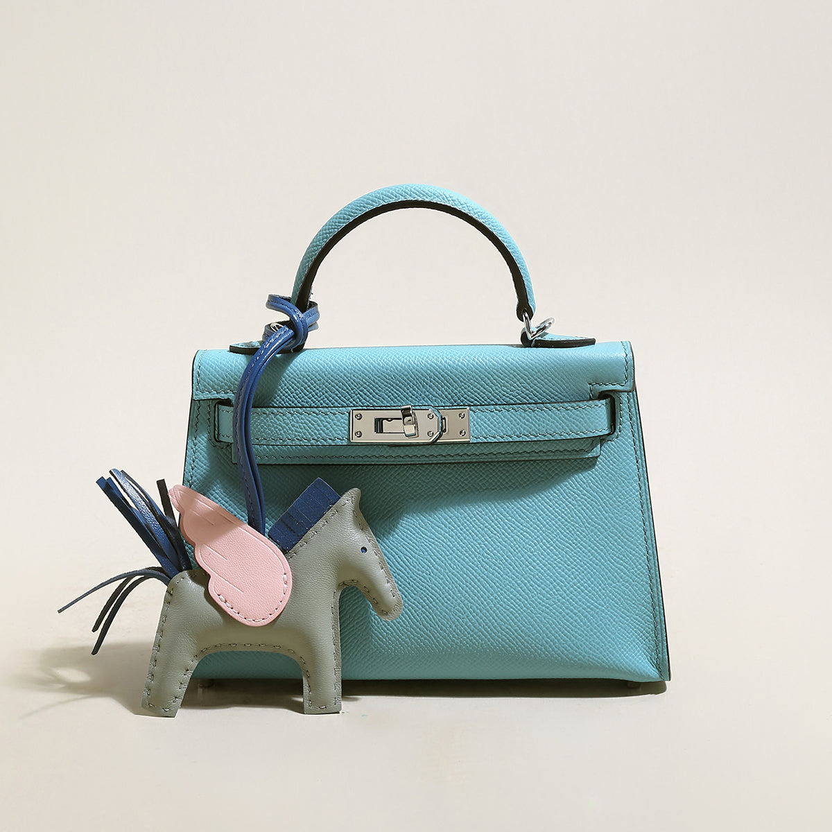 Petit sac à main tendance avec breloque cheval