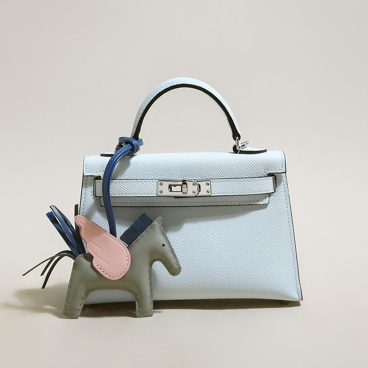 Petit sac à main tendance avec breloque cheval